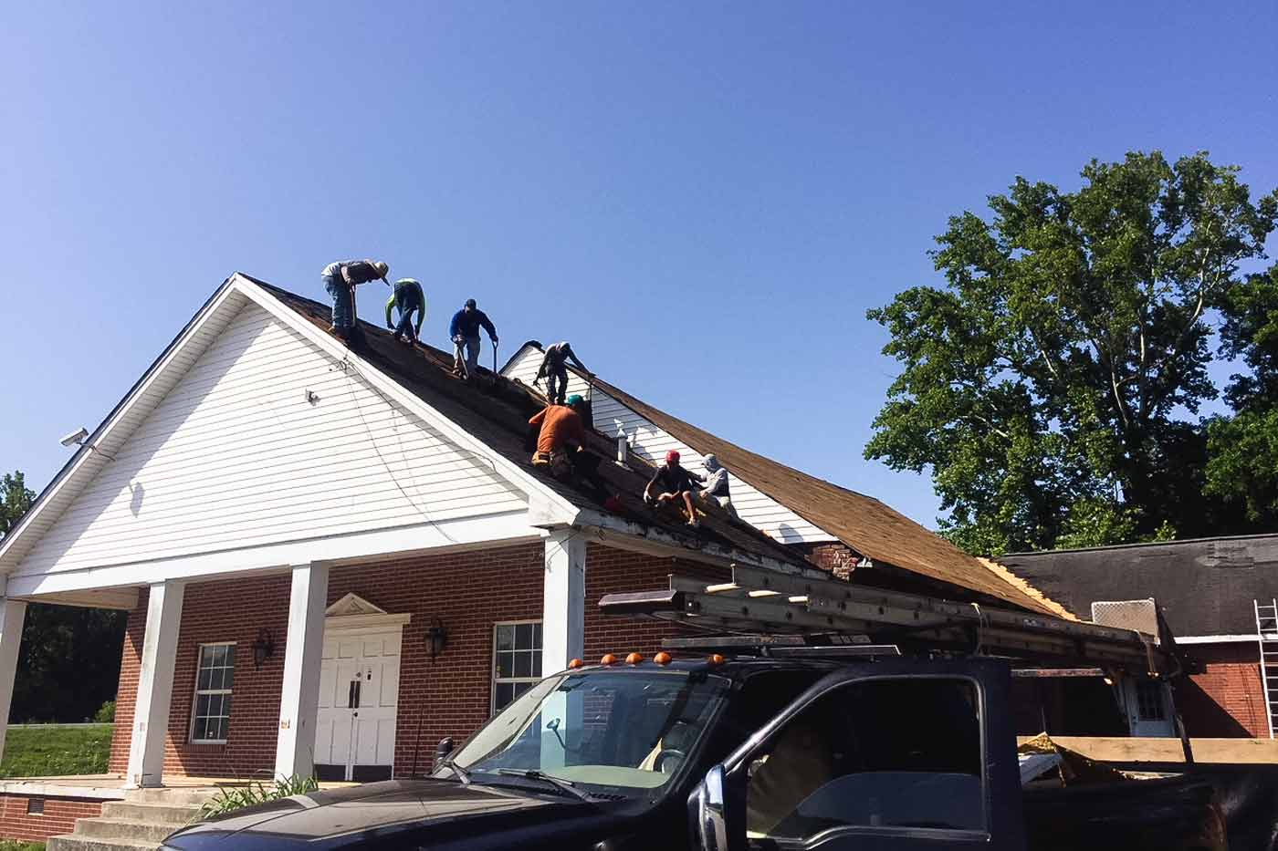 Construction crew restoring the roof