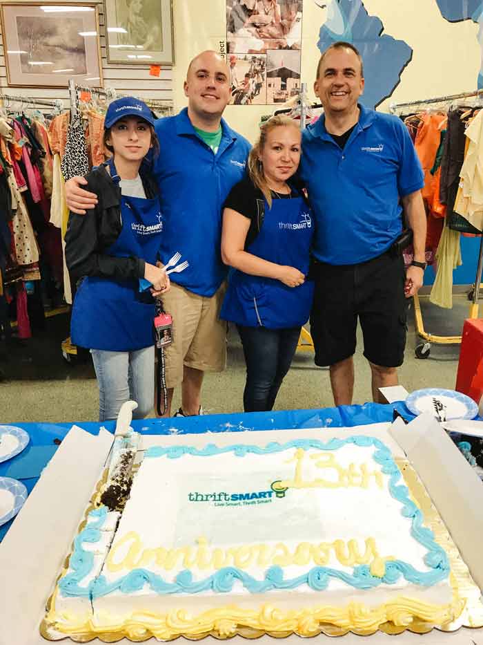 Operations Manager Bruce Krapf (far right) with Thriftsmart staff at its in-store 13th Anniversary Celebration