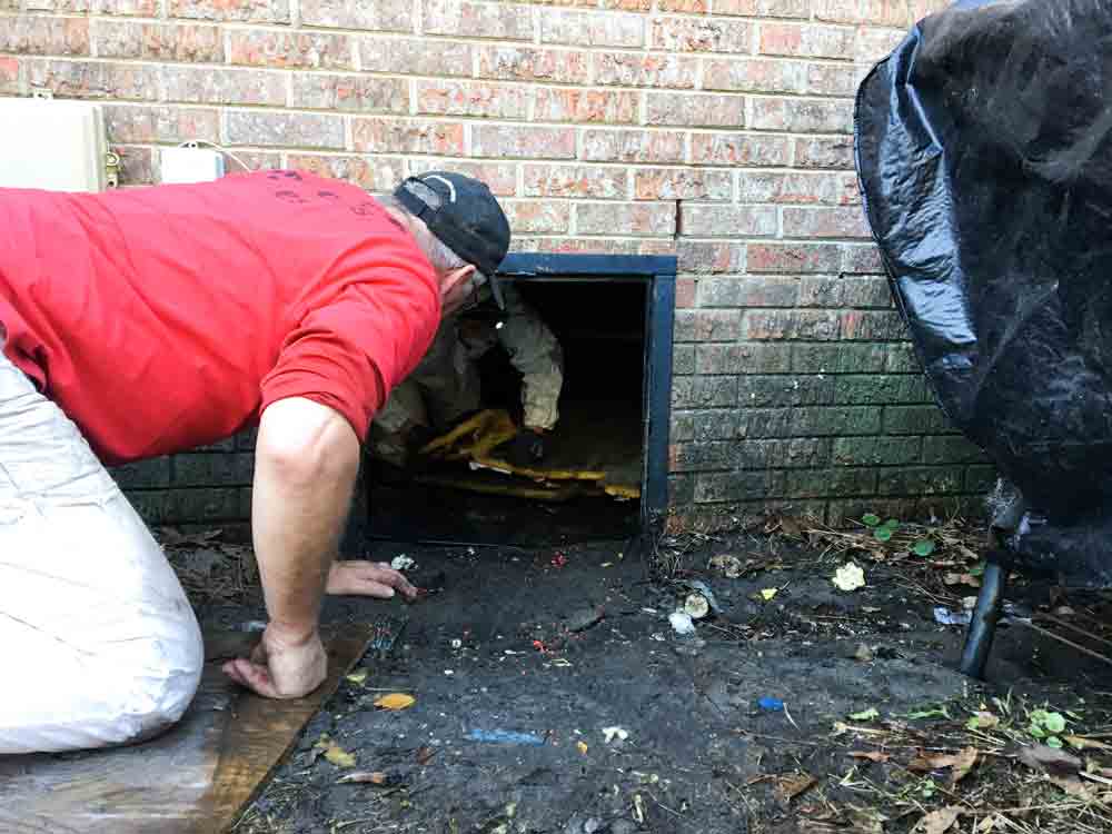 Removing duct work from a crawl space in a flooded home