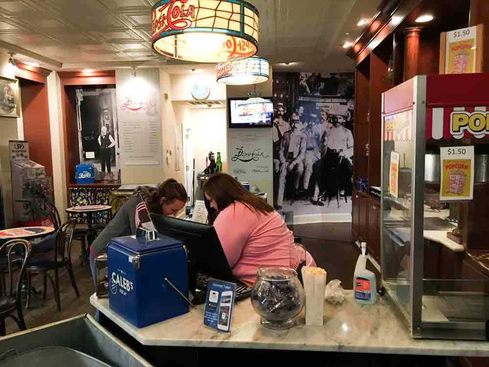 Fellowship team member Sarah prays with Melissa